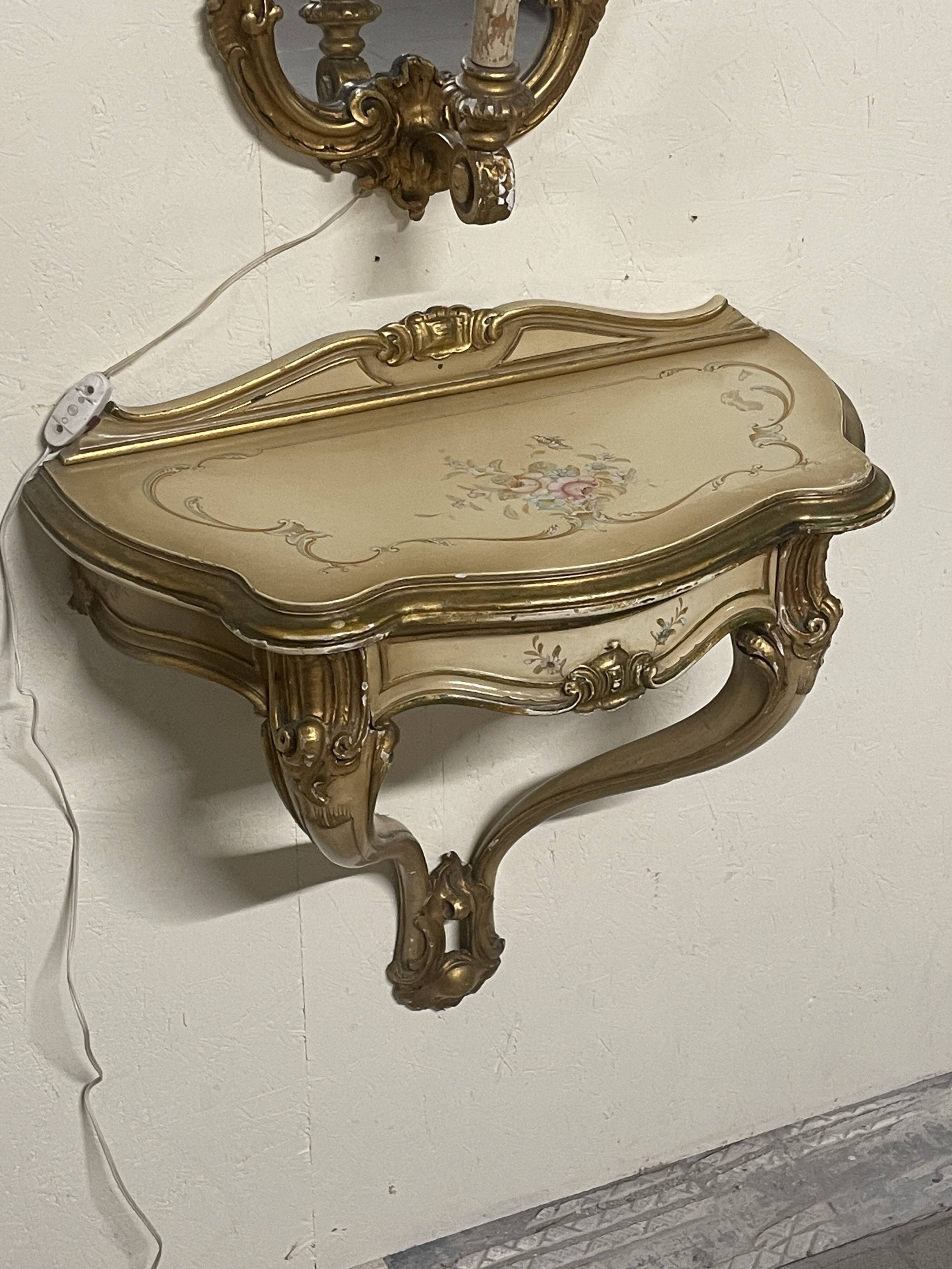 Pair of wall-mounted consoles with a mirror in Louis XV style.