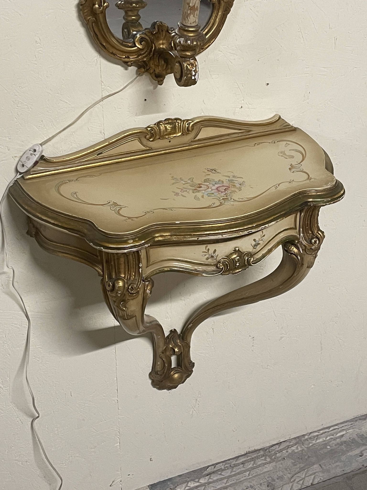 Pair of wall-mounted consoles with a mirror in Louis XV style.