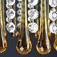 Suspension with tassels drops of water an glass
