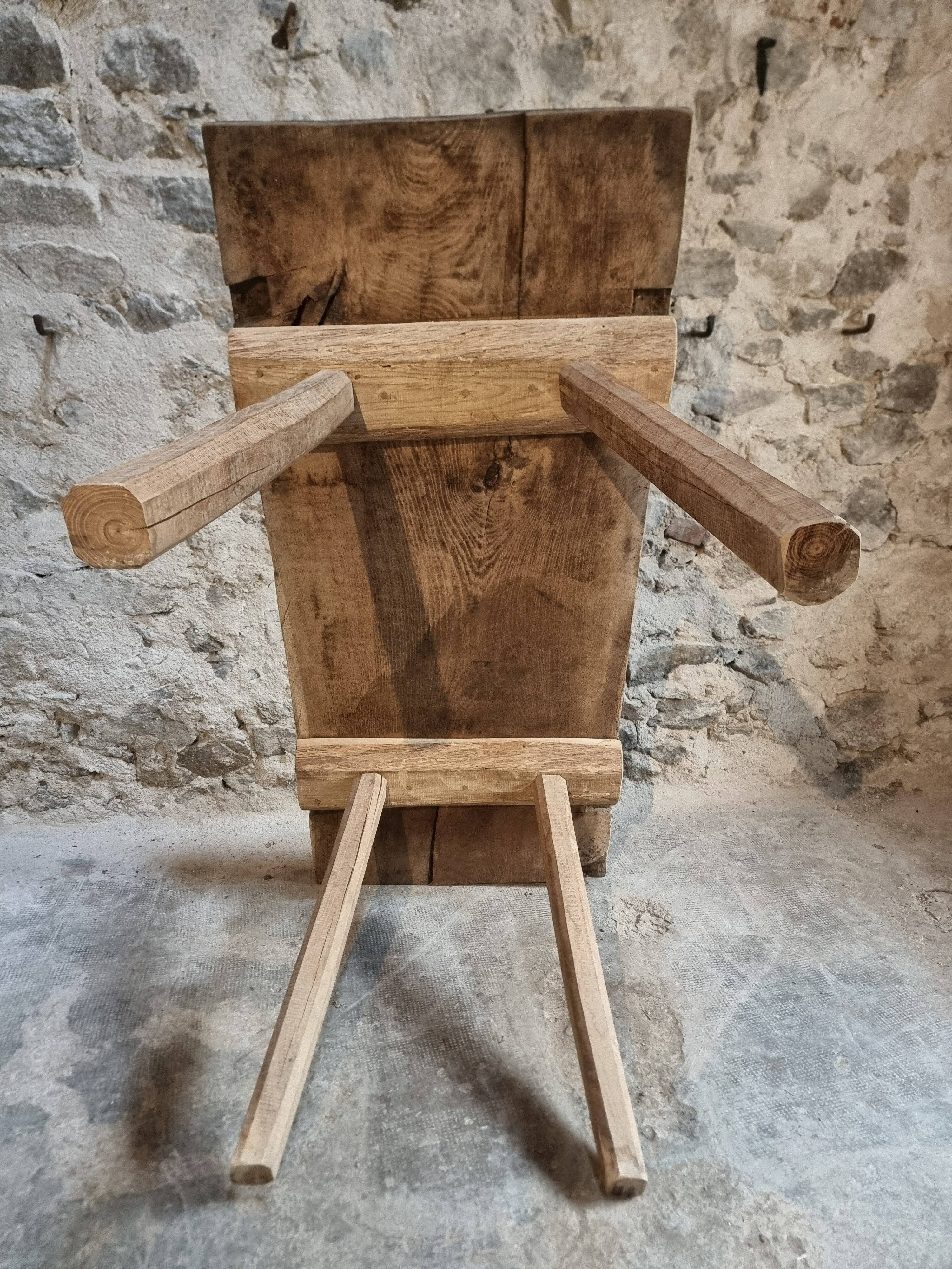 Antique work table / primitive dining table in oak, Hungary, circa 1900–1930.