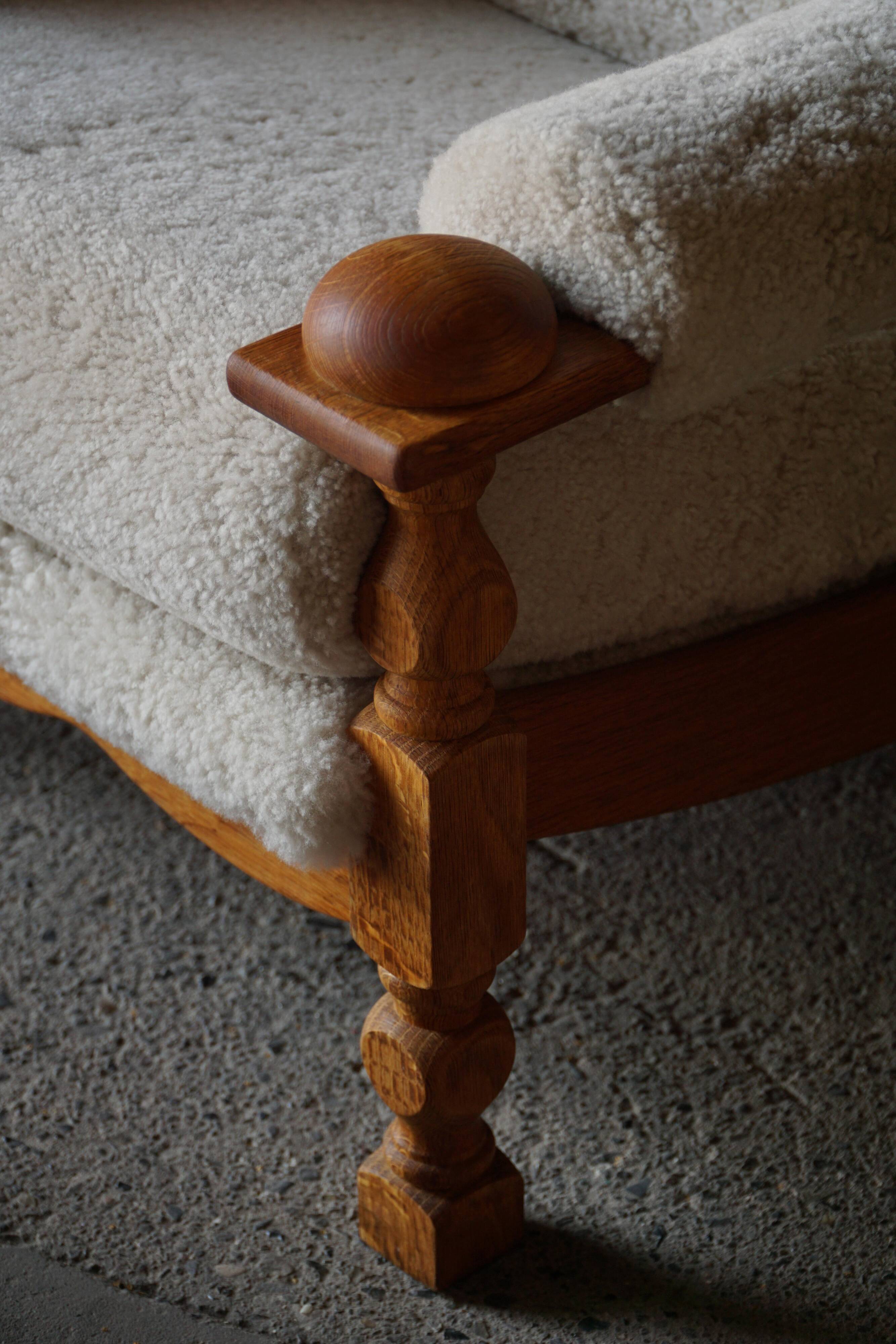 Henning Kjærnulf, lounge chairs in oak and lambswool, mid-century Danish, 1960s.