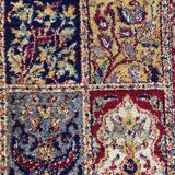 Vintage mechanical Turkish rug with box decoration on a red and navy blue background 139 x 68 cm