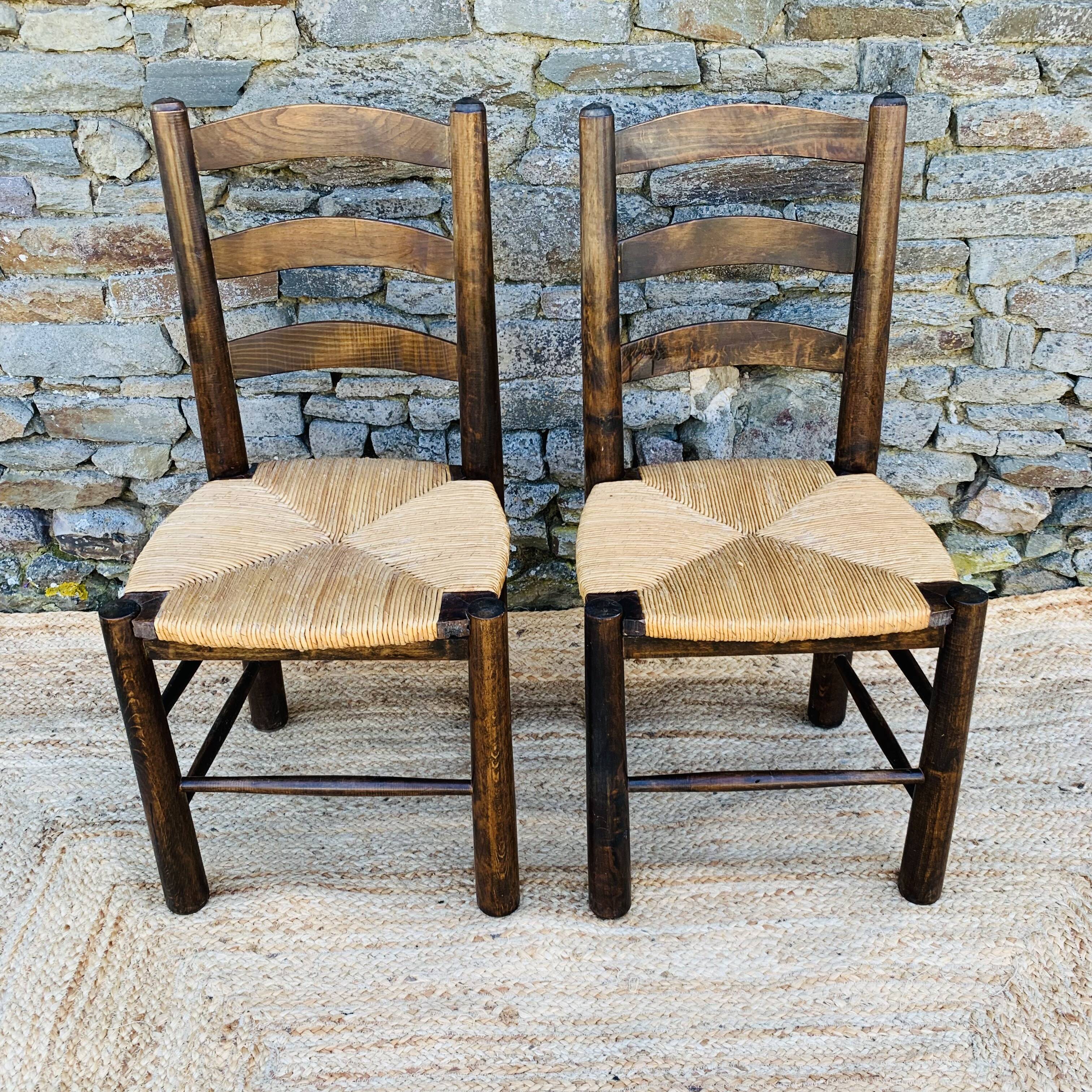 Pair of Georges Robert chairs