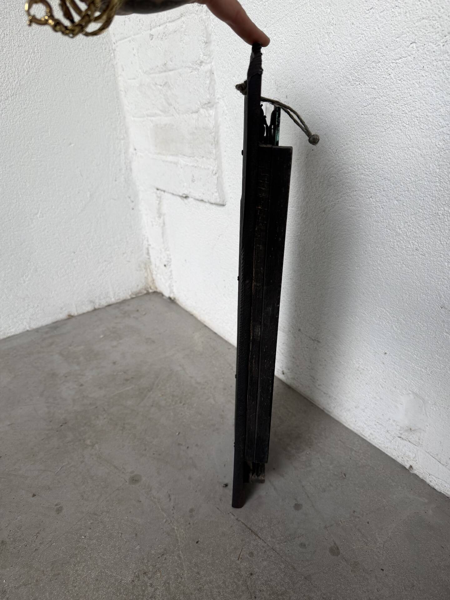 Brutalist hammered mirror, free-form, patinated metal.
