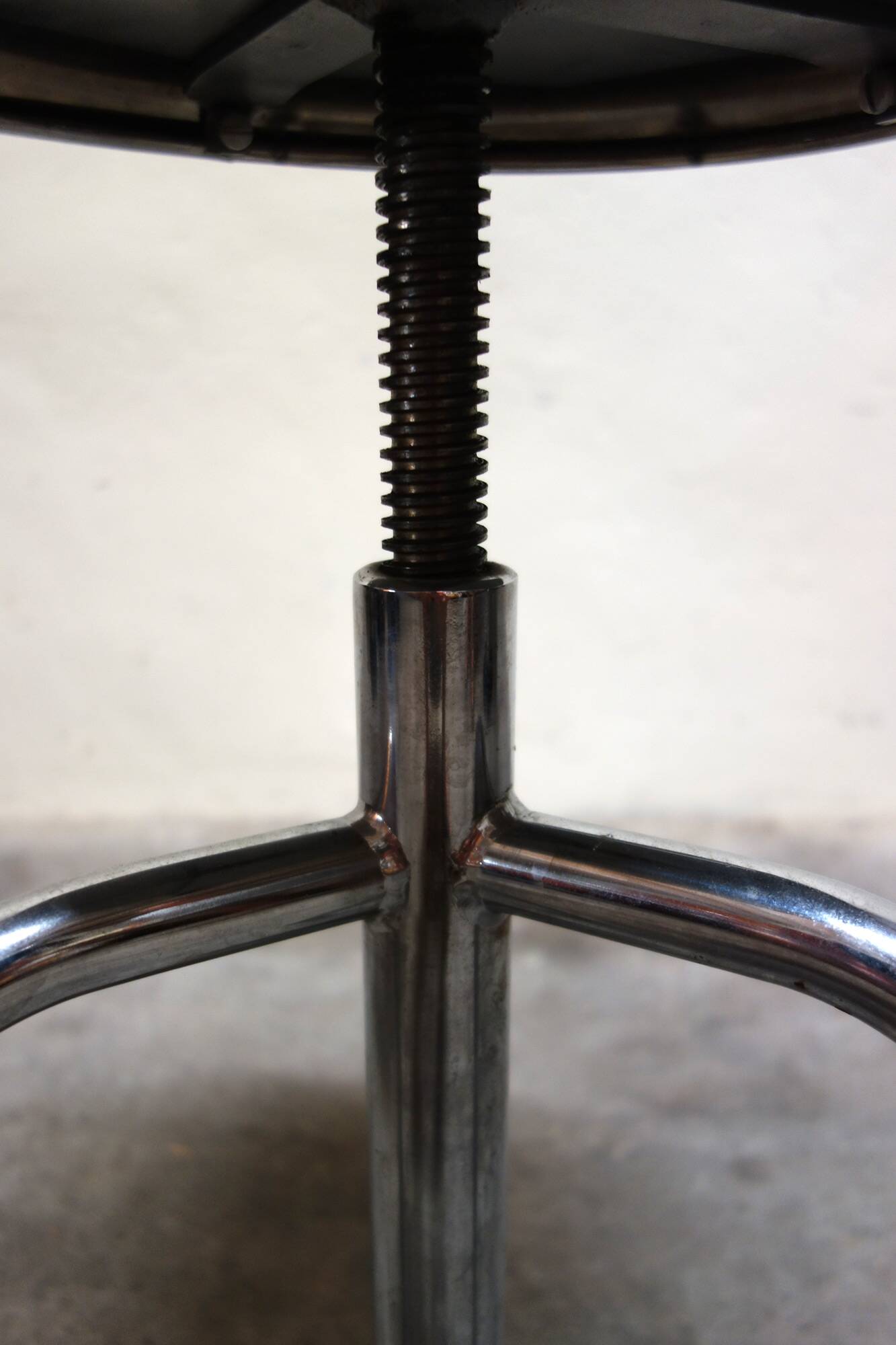 Old chrome metal swivel medical stool