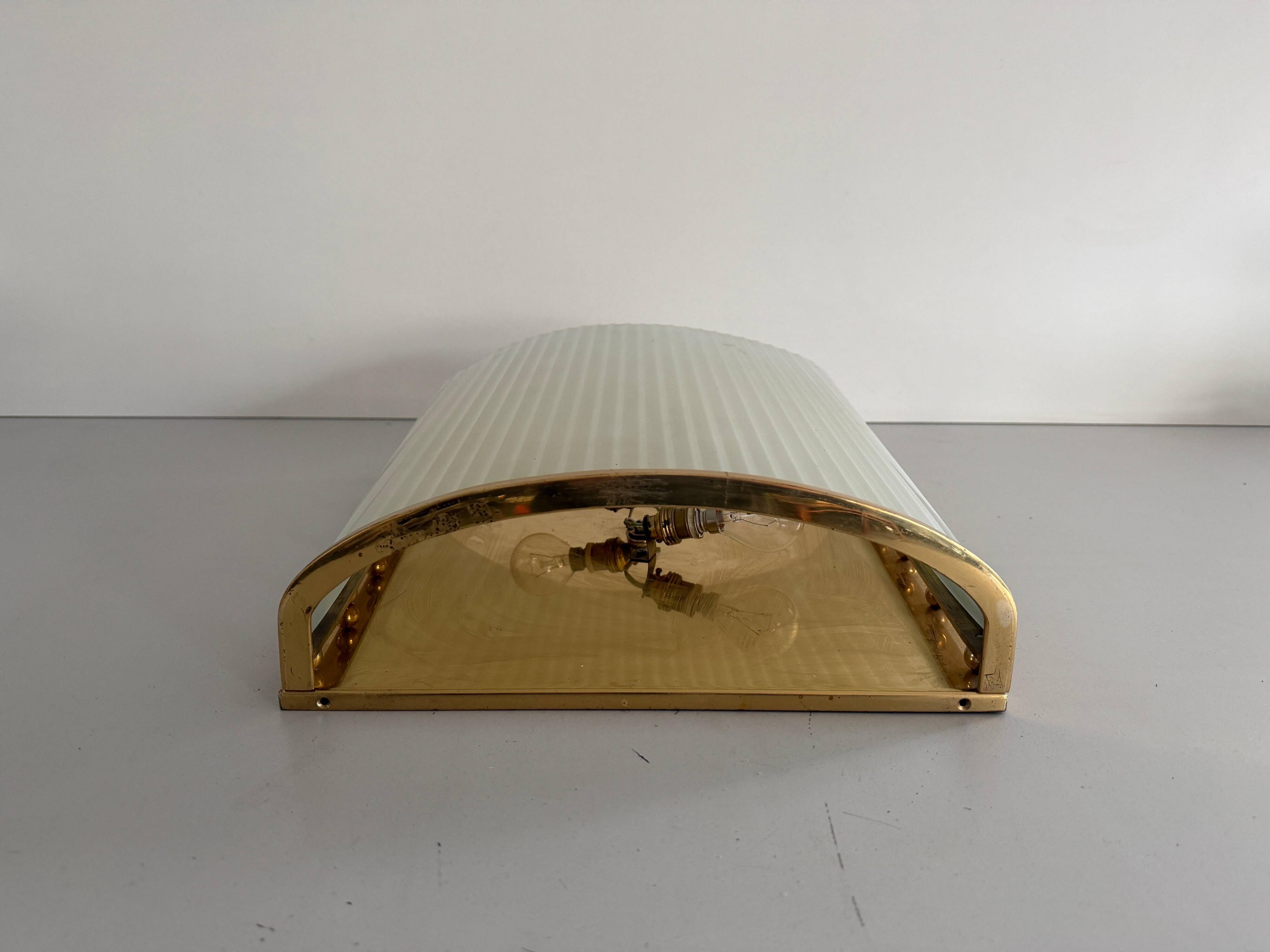 Large heavy glass wall light with a brass frame from the mid-century, 1950s, Italy.
