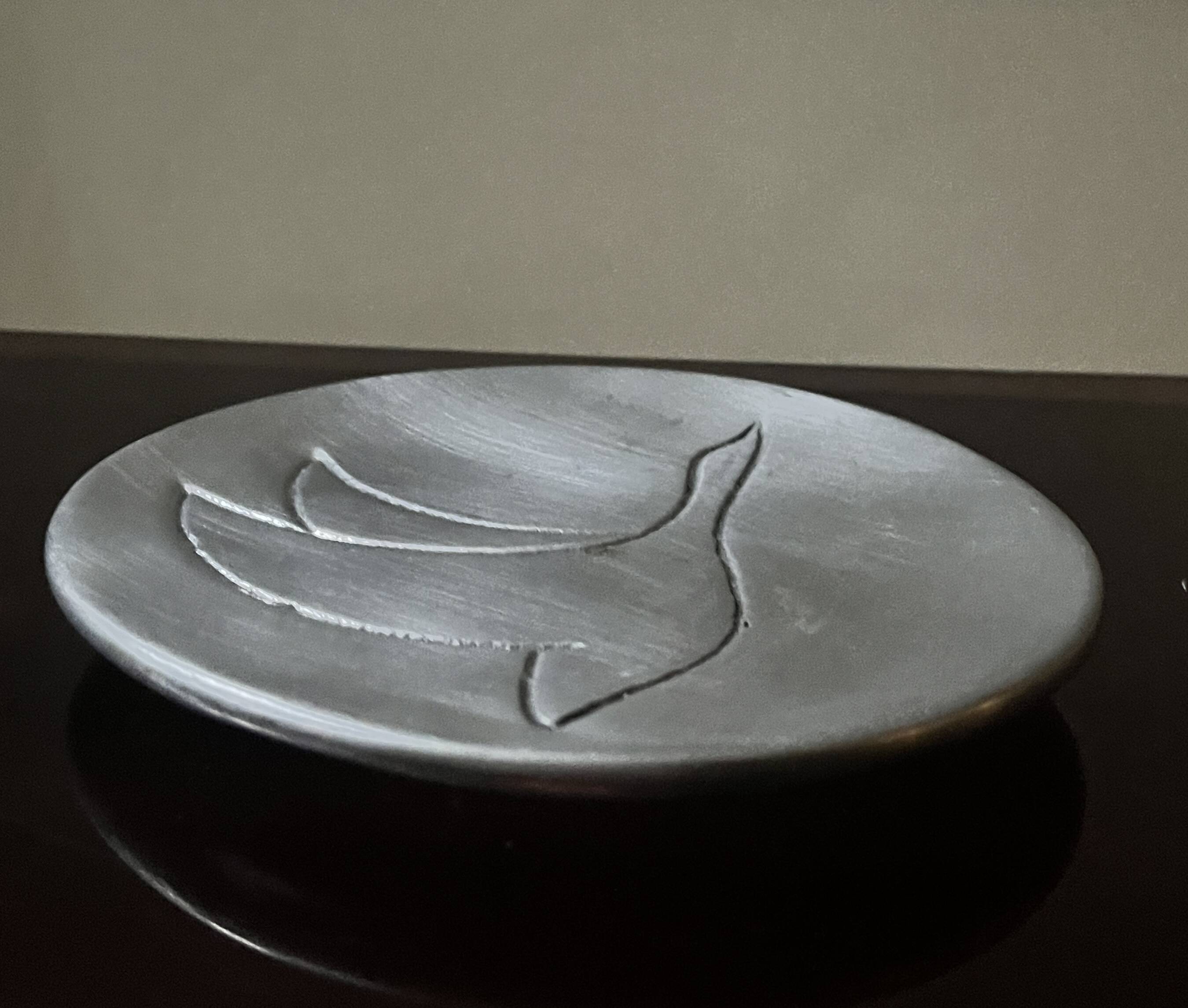 polished aluminum pocket emptier, signed and stamped in the mass