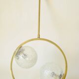 Mid century modernist pendant light in brass and textured glass ball