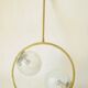 Mid century modernist pendant light in brass and textured glass ball