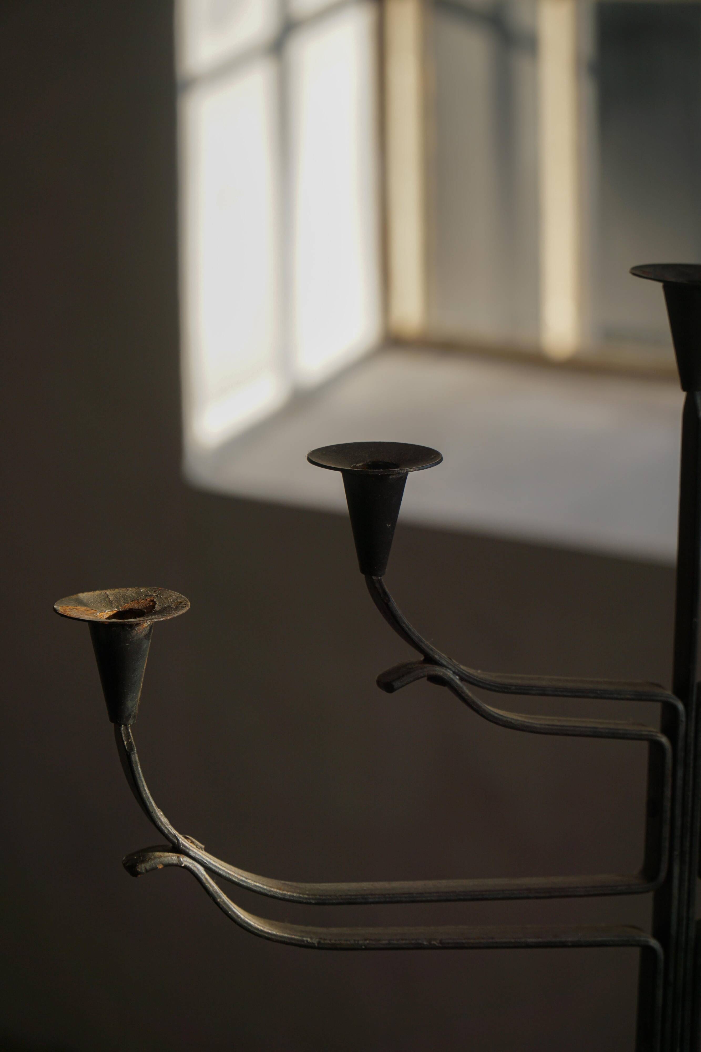 Brutalist Scandinavian candlestick in wrought iron and metal from the mid-20th century.