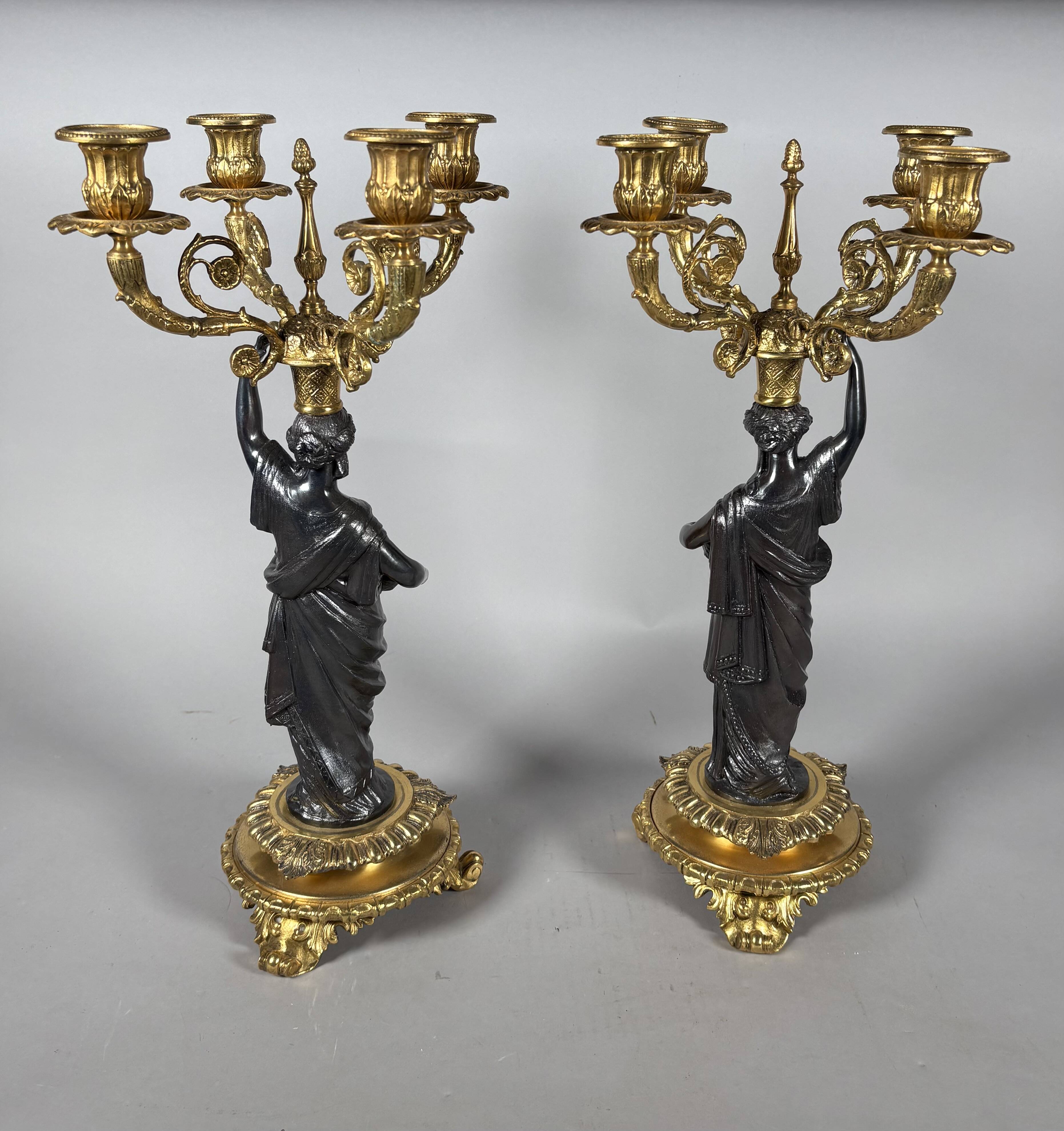 Pair of candelabra with women in the antique style of Napoleon III.