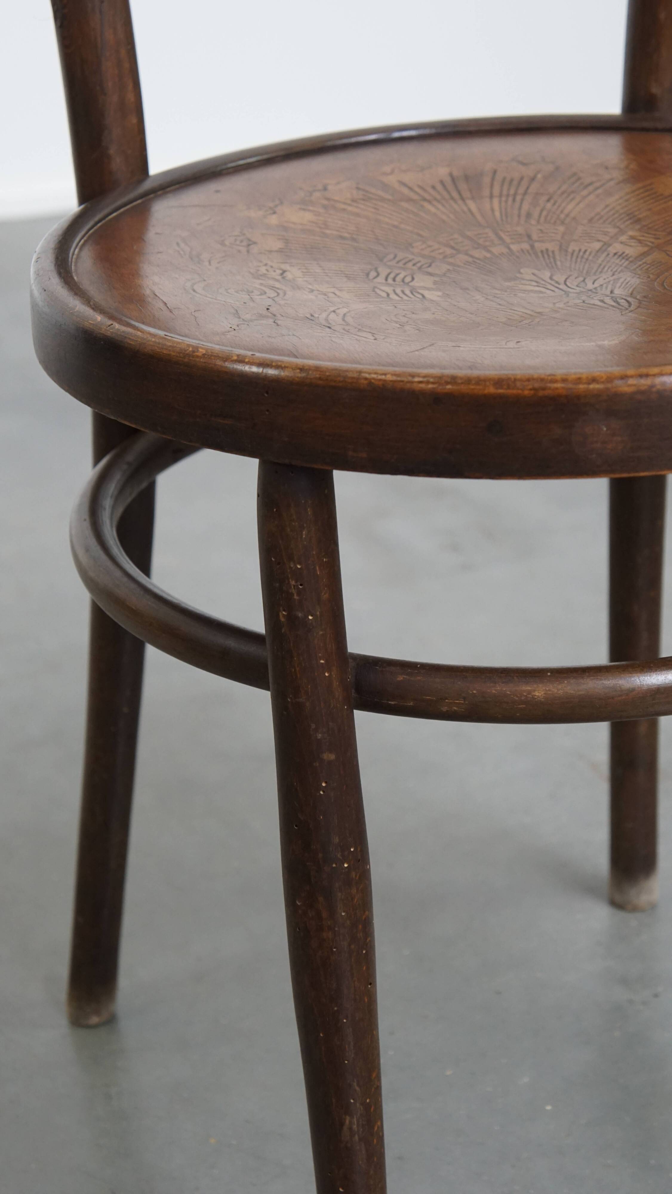 Bistro chair with carved seat