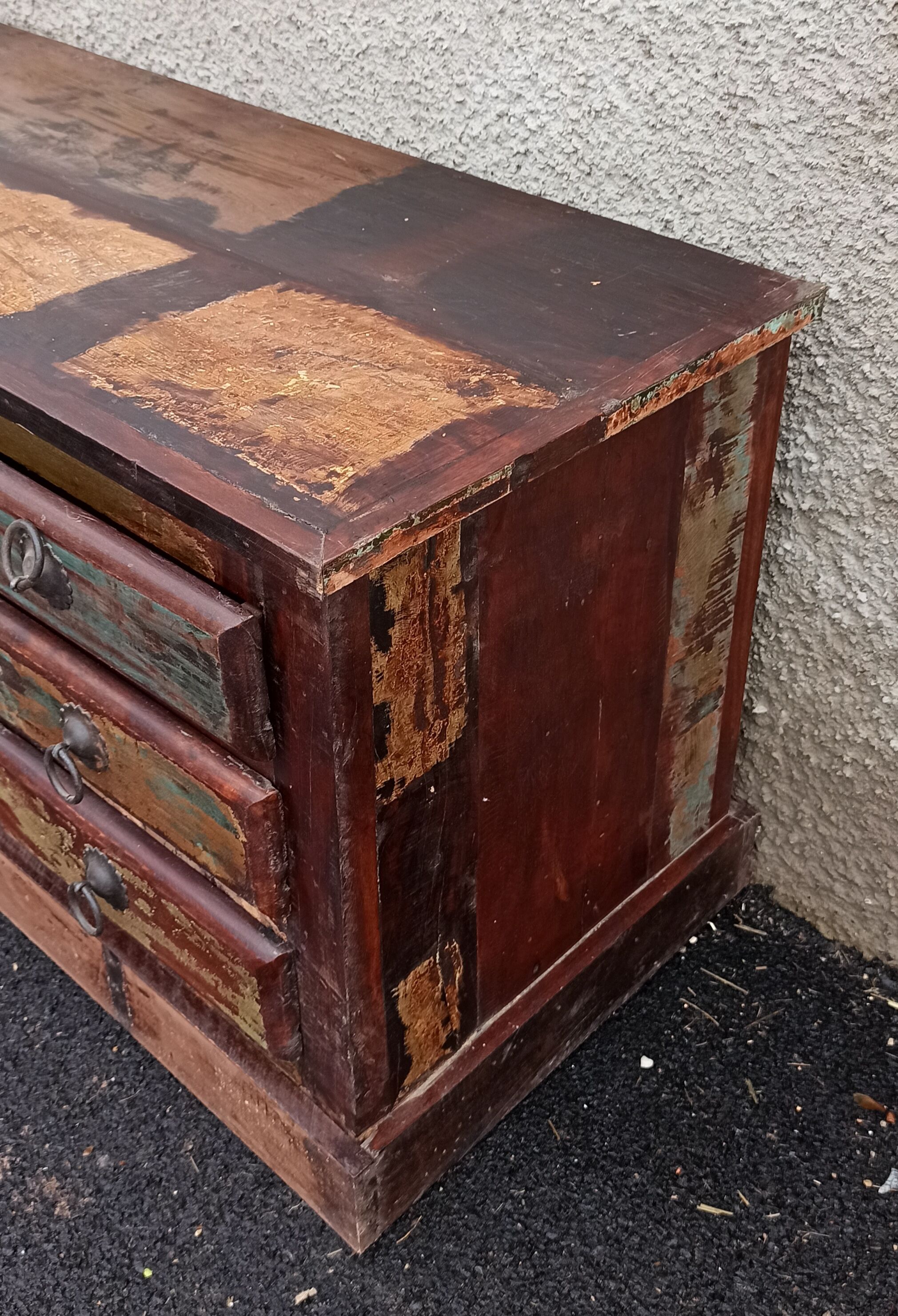 Furniture low in colorful wood. 12 drawers and 1 door