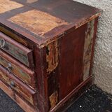 Furniture low in colorful wood. 12 drawers and 1 door