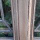 Oak entrance door and its frame and transom, wrought iron gates