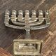 Chandelier, seven-branched menorah, in brass.