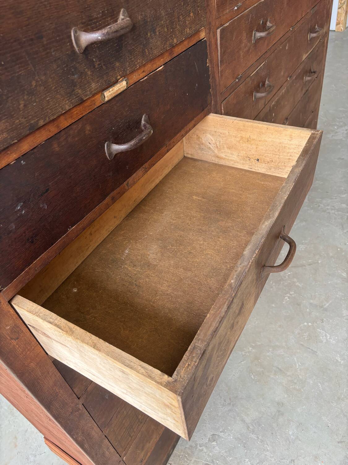 Large wooden workshop cabinet with 16 drawers, antique from the early 1900s.