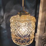 Moulded glass lamp with a cubic-spherical relief design.