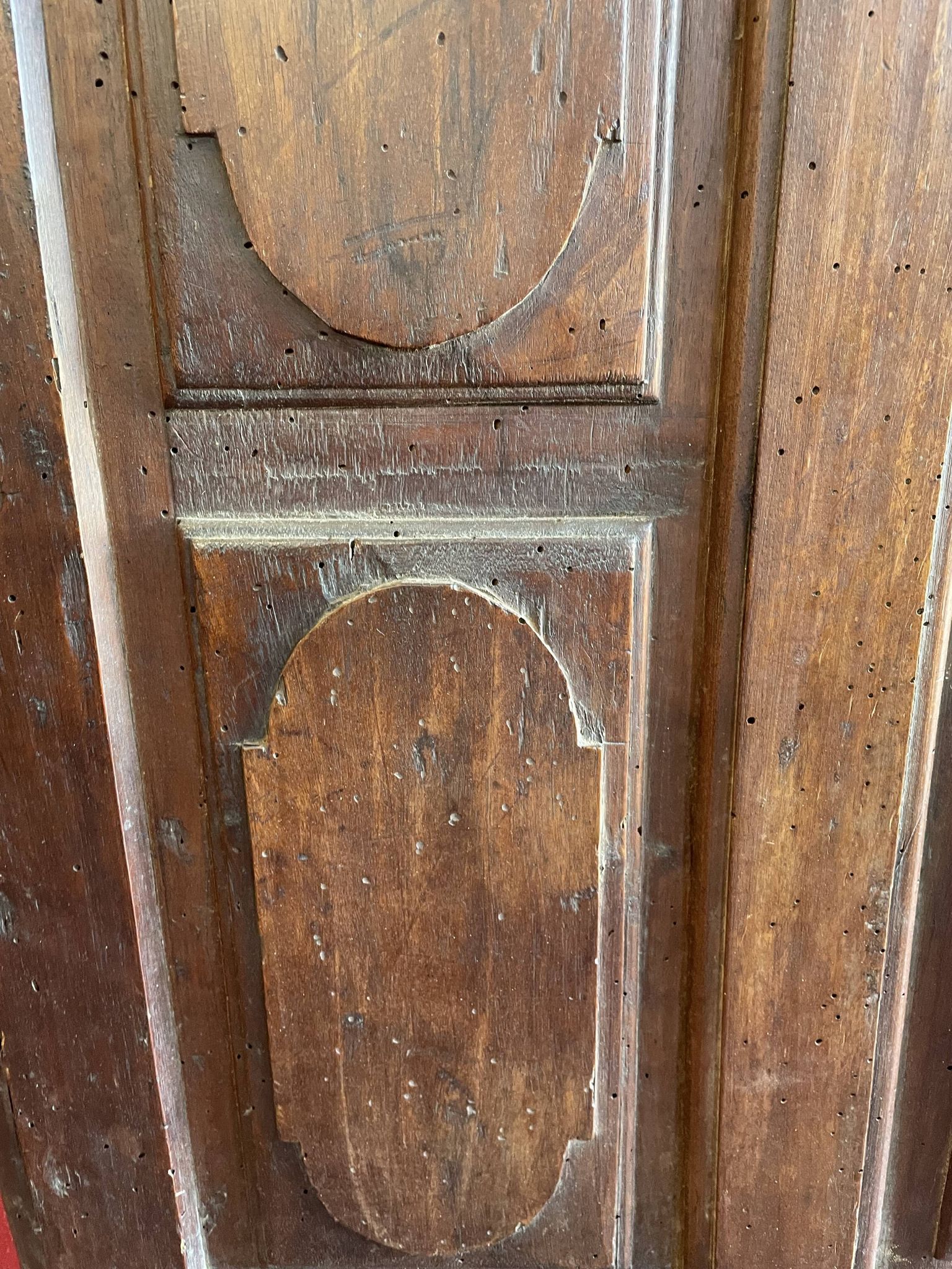 France old 18th century walnut closet door. Composed of 8 finely carved panels.