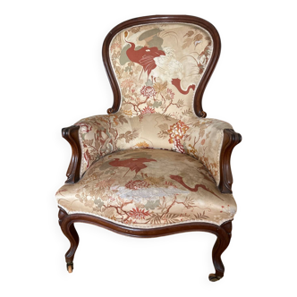 Violin-backed cabriolet armchair, in the Louis XV style.