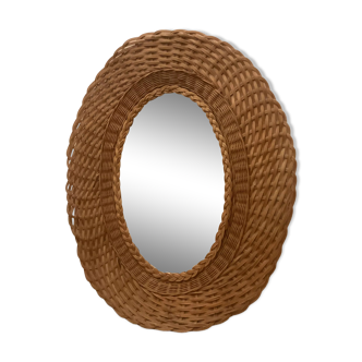 Old oval mirror woven wicker rattan