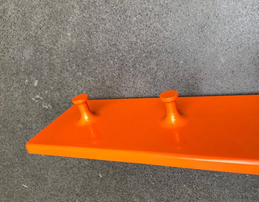 Orange coat rack from the mid-century space age, 1960s.