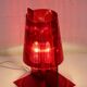 Red plastic Kartell table lamp - model Take - design by Ferruccio Laviani