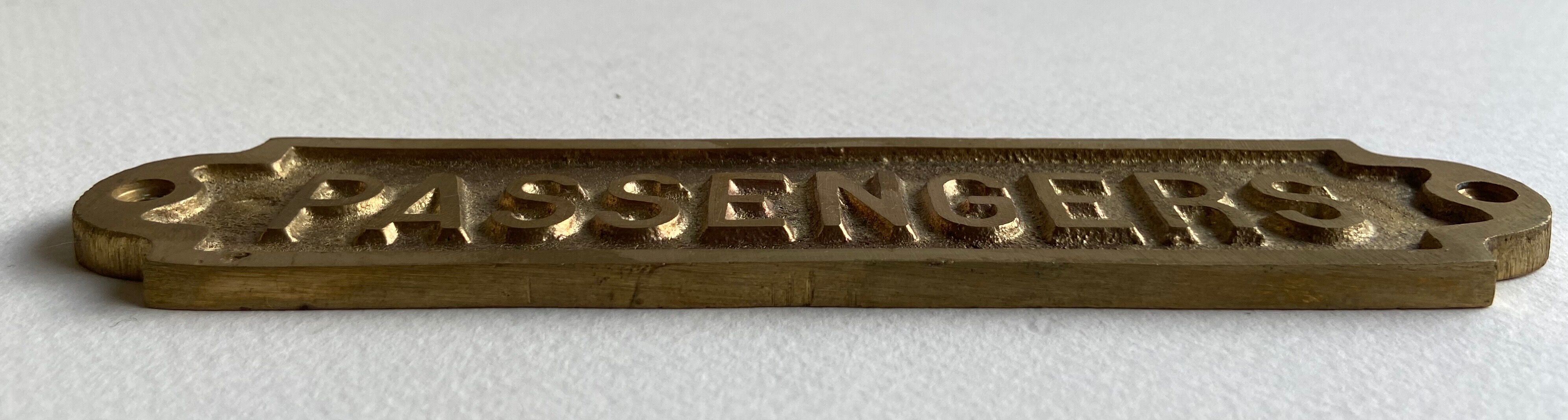 "Passengers" gold brass plate