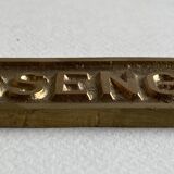 "Passengers" gold brass plate