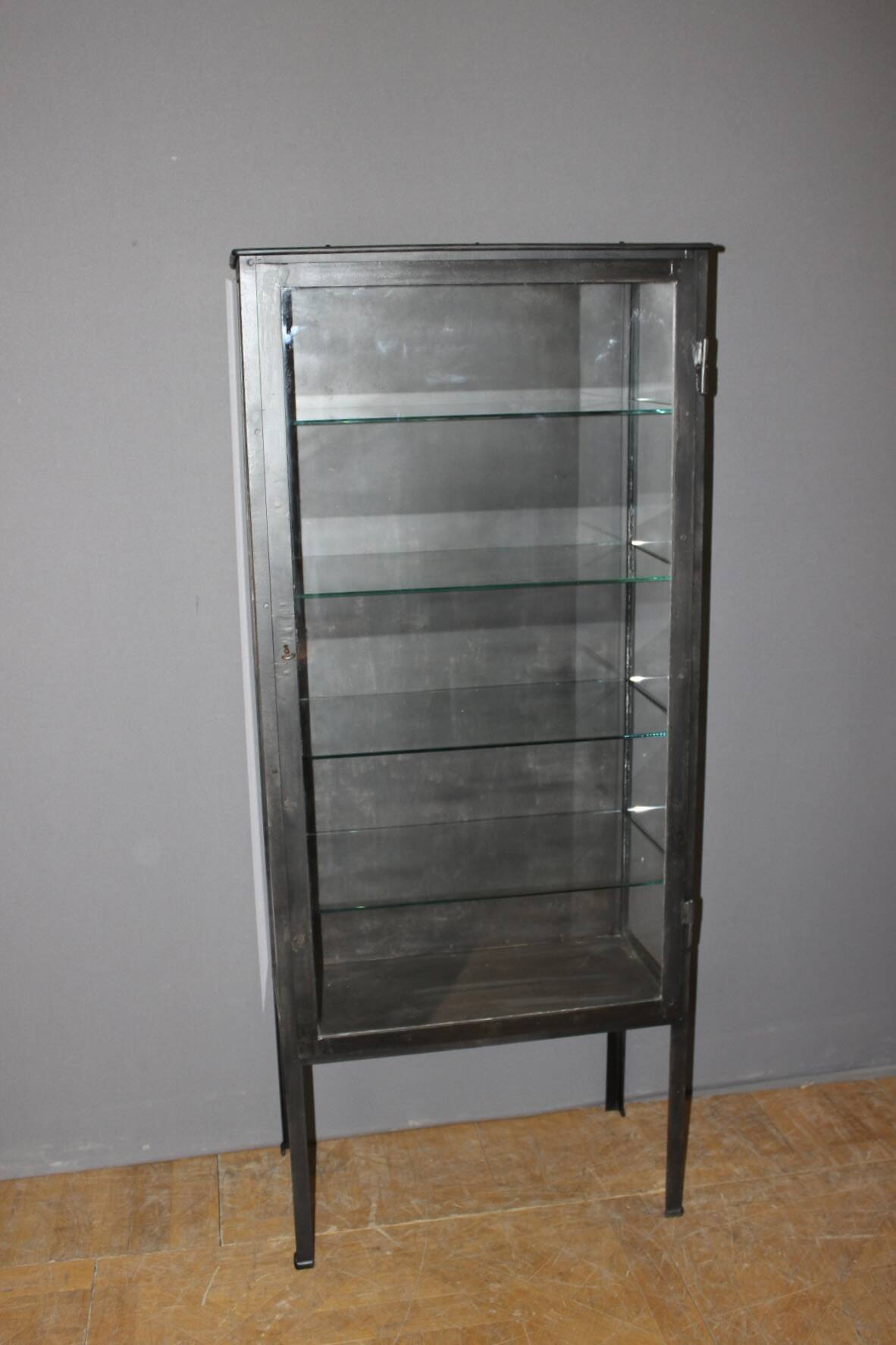 Iron display cabinet with black patina from around 1920