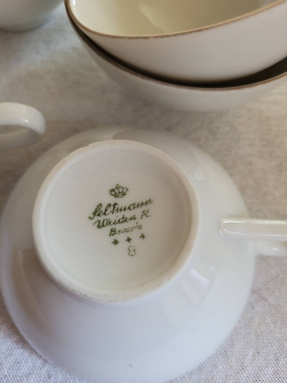 6 white and gold porcelain cups