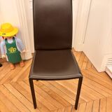 Many brown leather chairs "Roche Bobois"