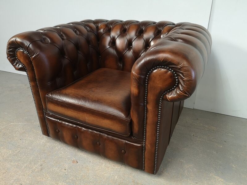 Brown leather chesterfield armchair