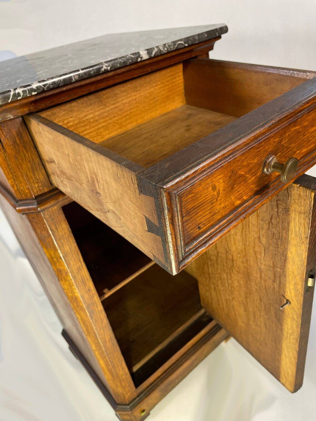 Provincial antique bedside table in oak, marble top, late 19th century.