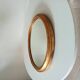 Antique oval mirror in gilded solid wood