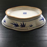 Chinese cup decorated with blue bamboo.
