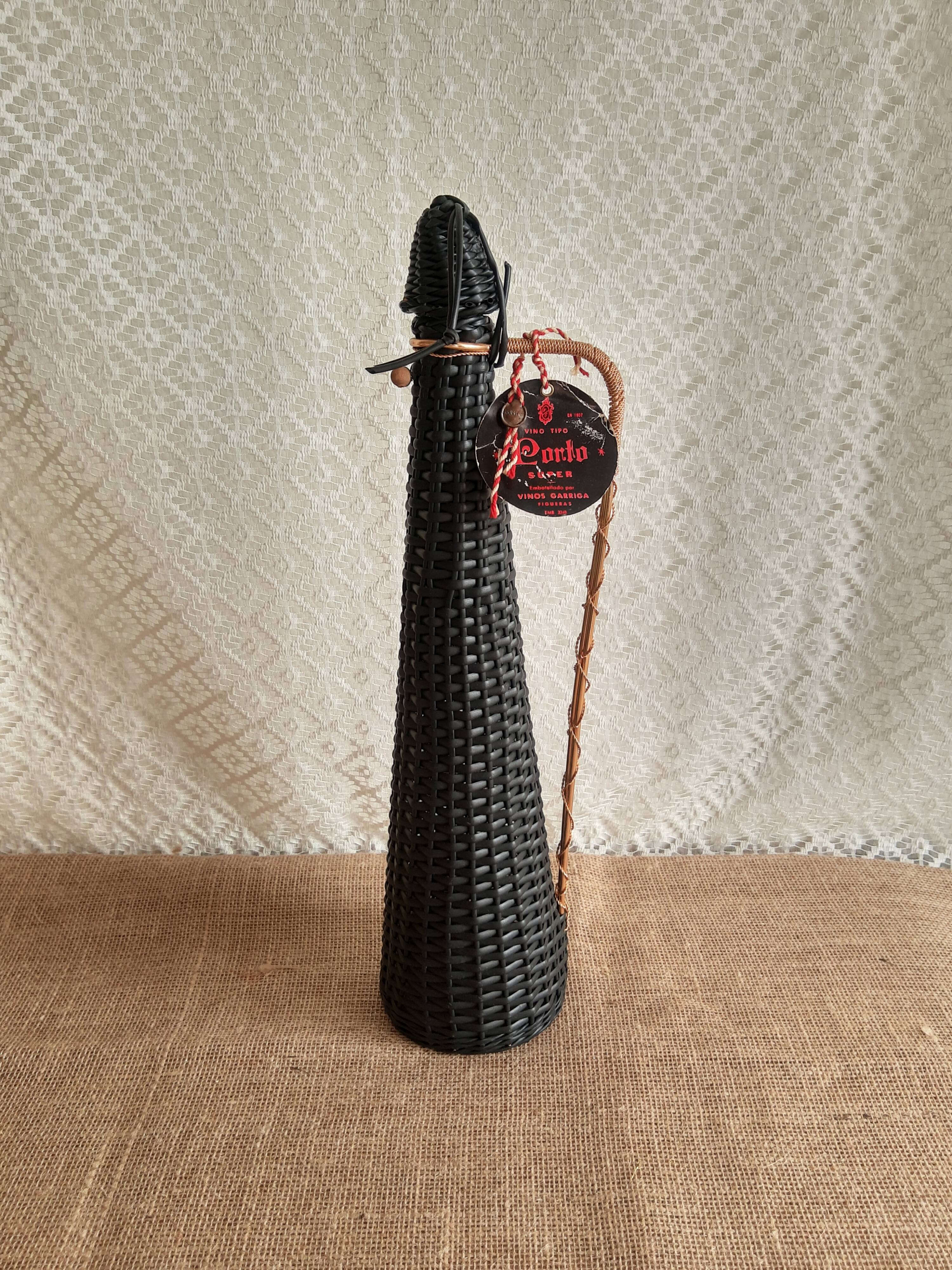 Glass bottle covered with black scoubidou with twisted golden handle - vintage