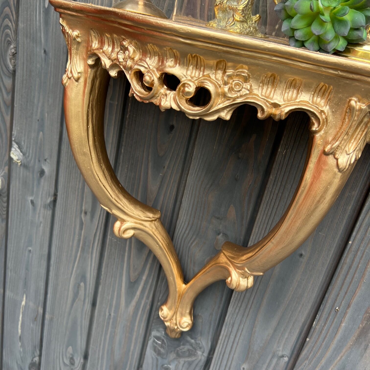Golden wall console, baroque style