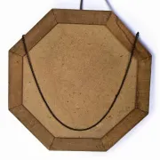 Octagonal mirror in carved wood