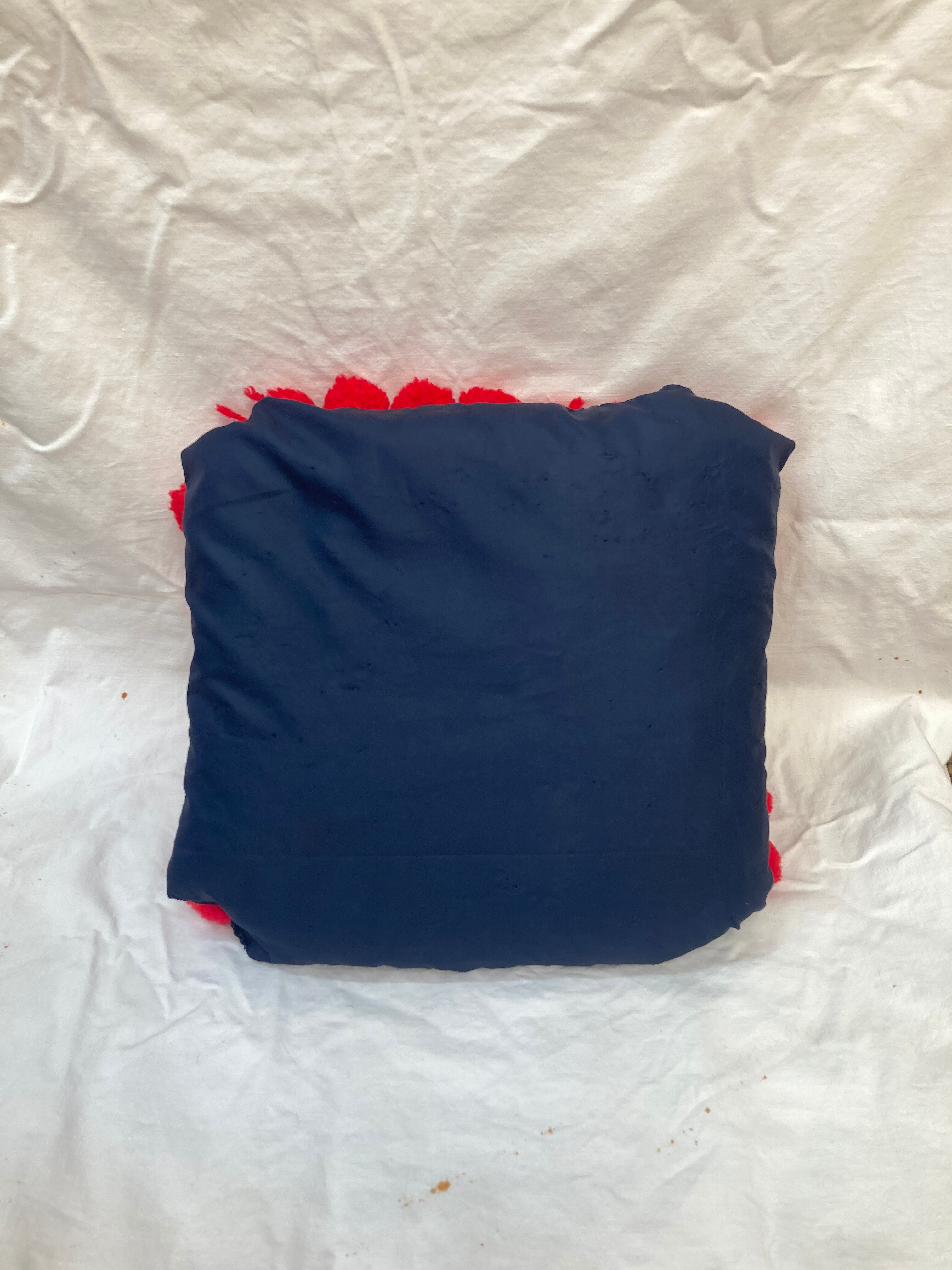 Vintage cushion red pompoms