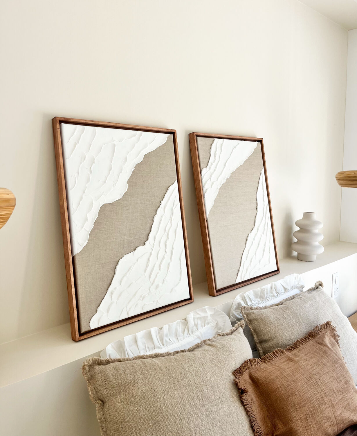 Diptych relief panels in linen and white.