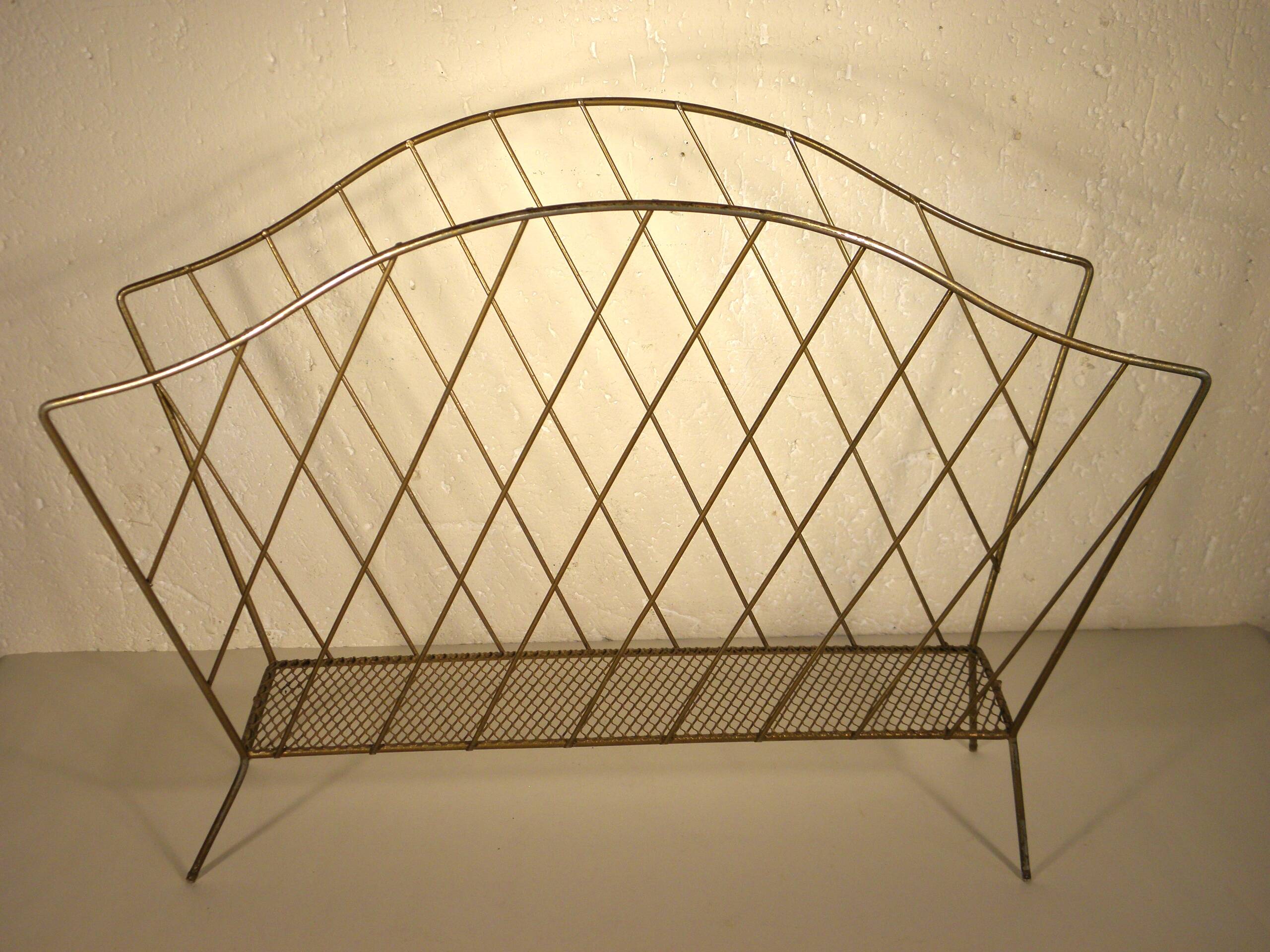 Golden metal magazine rack from the 60s
