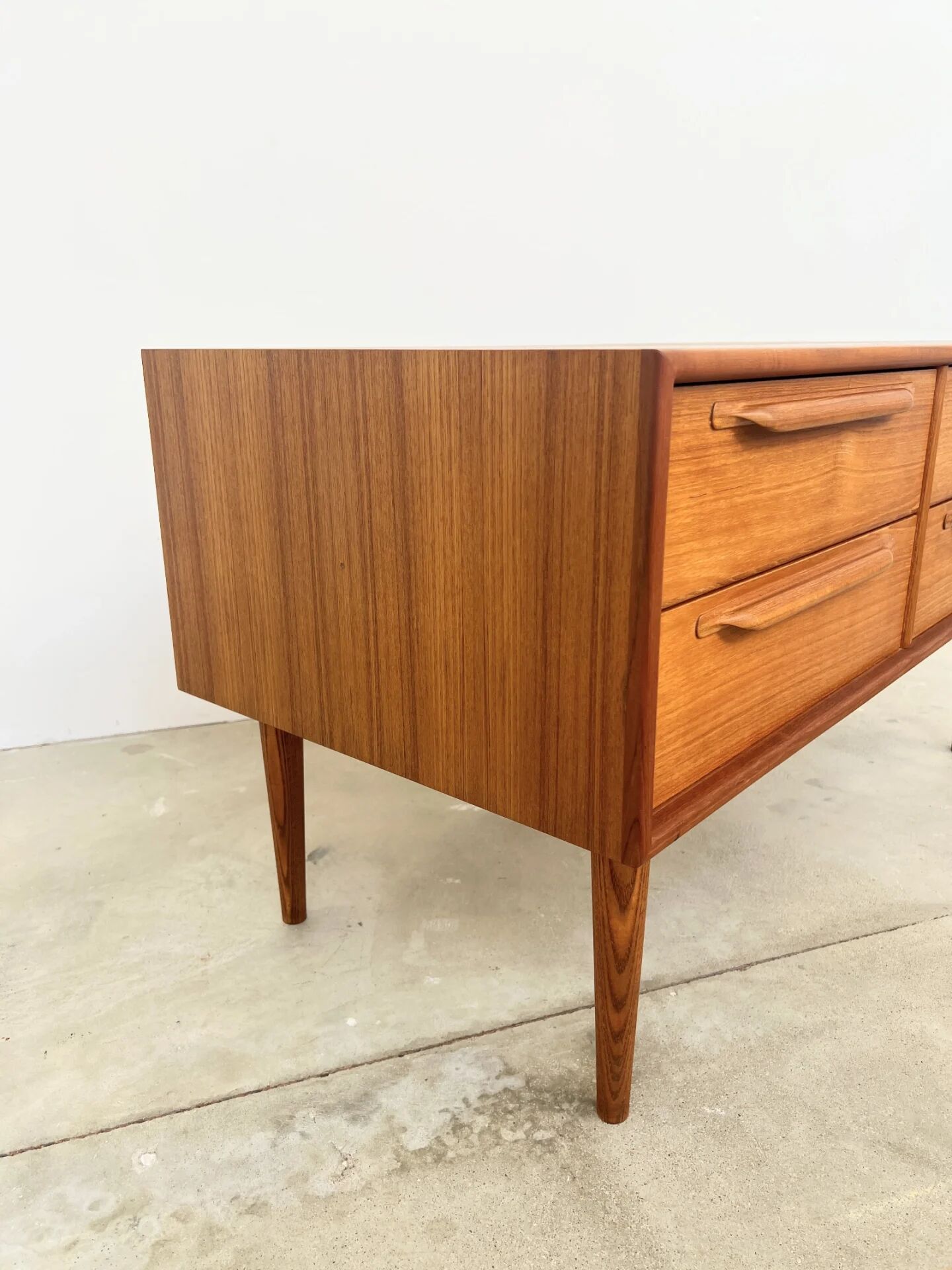Lowboard teak 4 drawers — Mid-century lines, tapered legs, 1960s