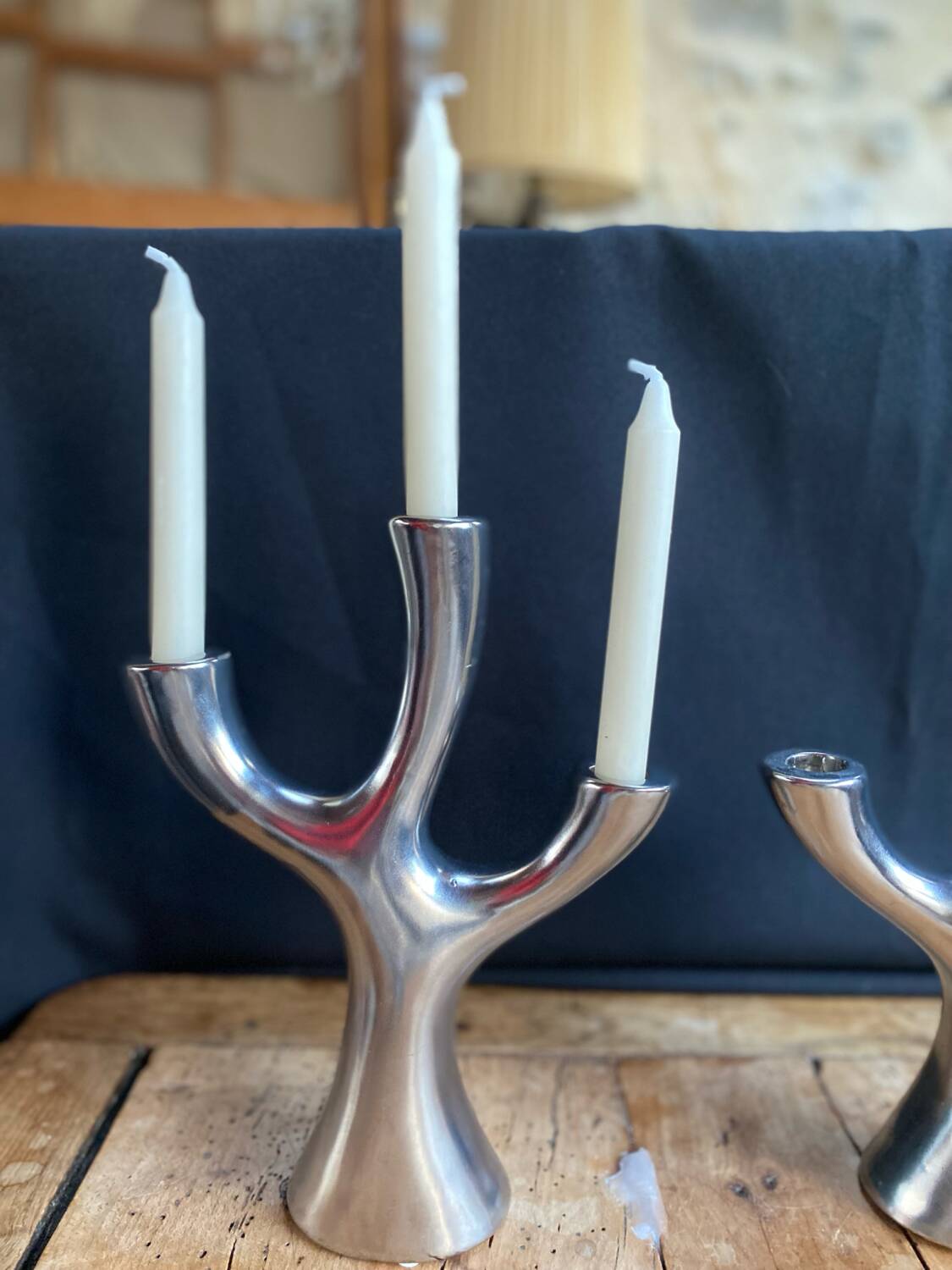 Silver candlesticks in the shape of a 3-branch tree