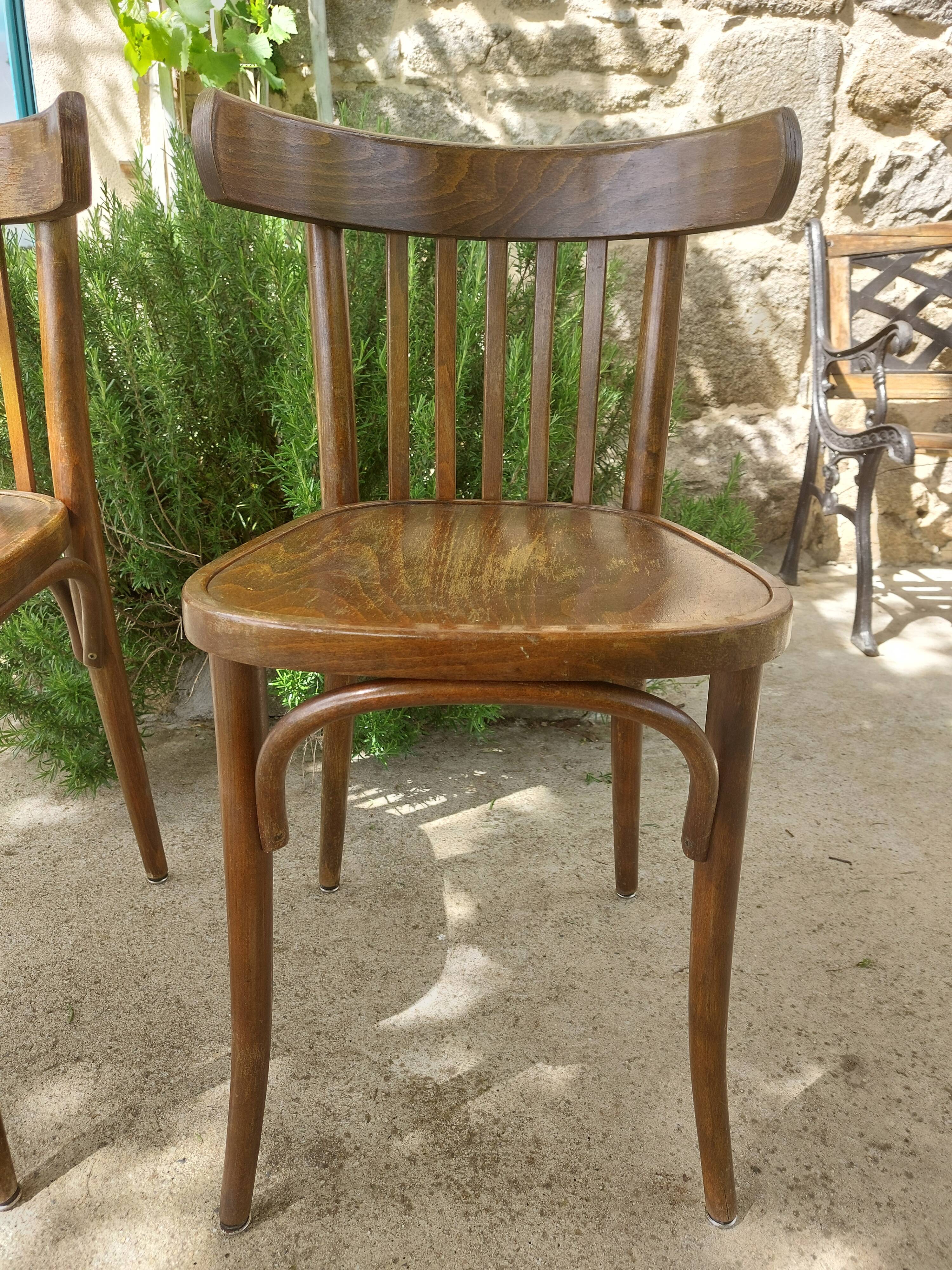 pair of dark bistro chairs, rounded backs, Baumann style