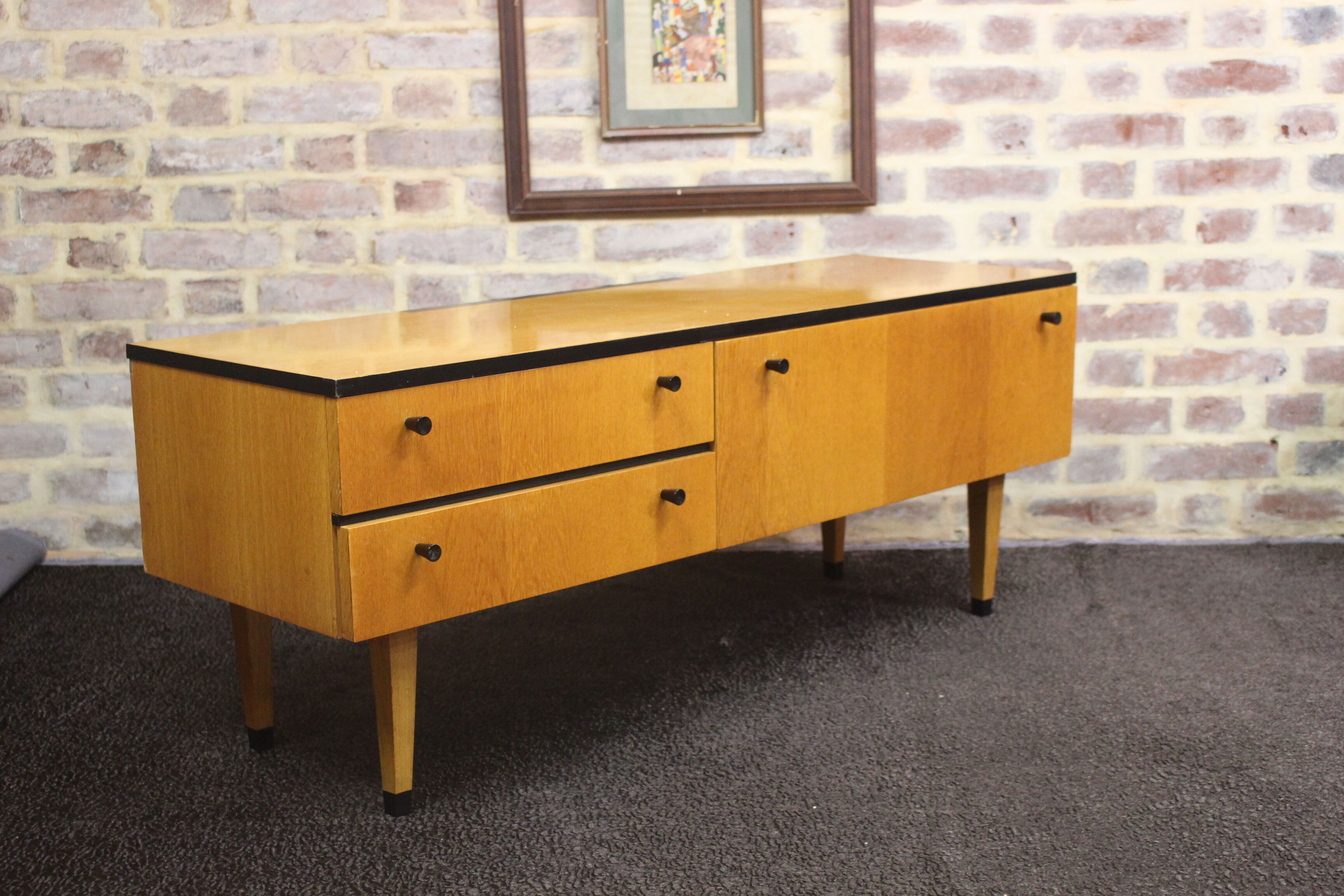 Black-gloved 50s varnished wooden sideboard