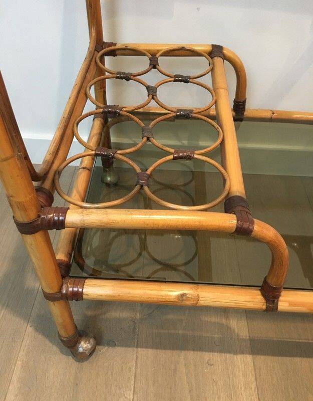 Rolling table made of rattan and leather straps