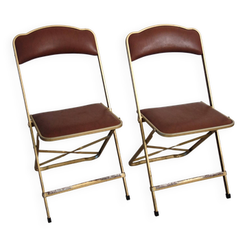 2 golden metal chairs with faux leather in the 60s/70s Opera style.