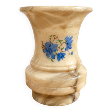 Vintage alabaster vase with blue floral decoration.