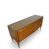 Veneered burl walnut chest of drawers with light warm brown glass top